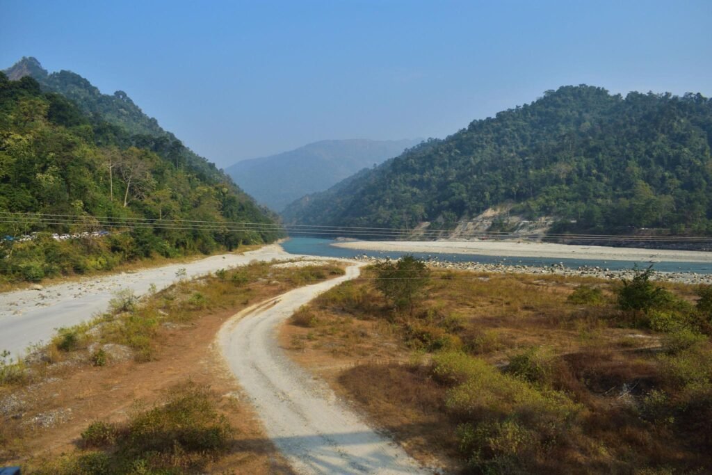 Beautiful river flowing through the forests of Dooars offering peaceful nature views.
